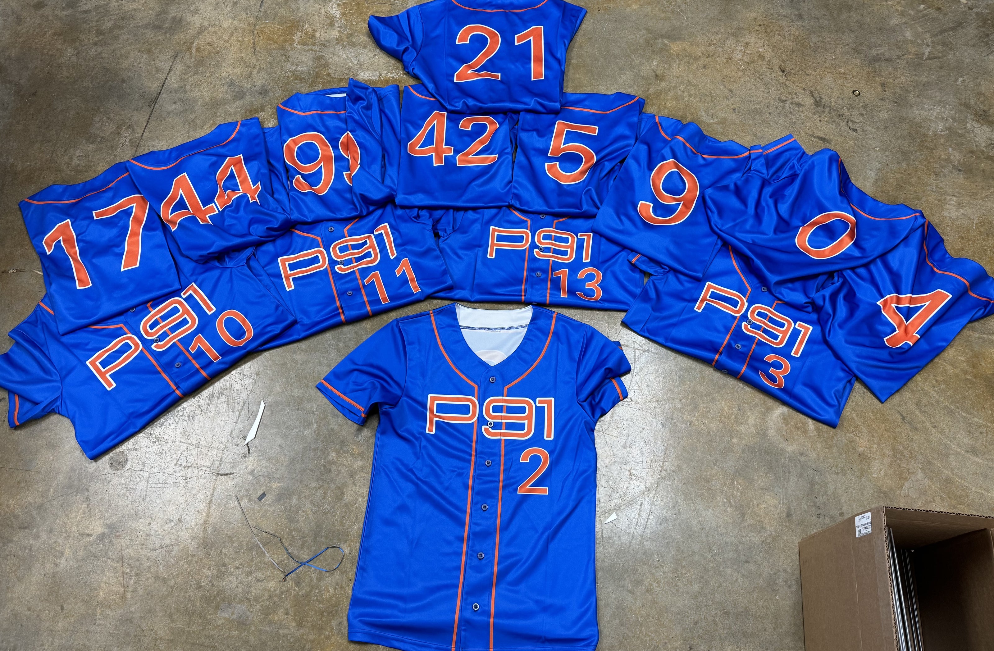 Image of a custom baseball jersey featuring vibrant, full sublimation printing, designed online, showcasing team logos and dynamic colors that resist fading and wear.