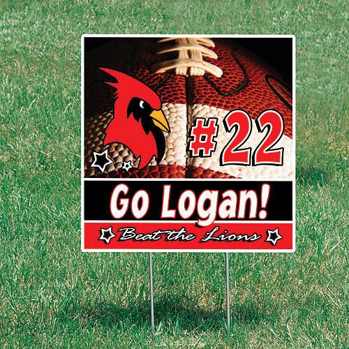 Detailed view of a sports yard sign placed at a community sports complex, advertising upcoming tryouts with striking graphics and clear text, made from robust materials suitable for repeated outdoor use.